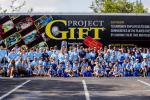 Group photo in front of Project GIFT trailer